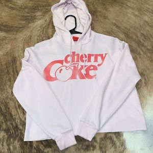 Coca cola brand size XS Pink with red cherry coke logo